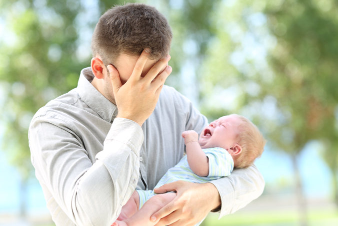 Sad Father with Baby