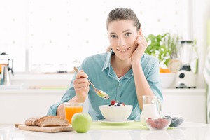 Woman eating yogurt